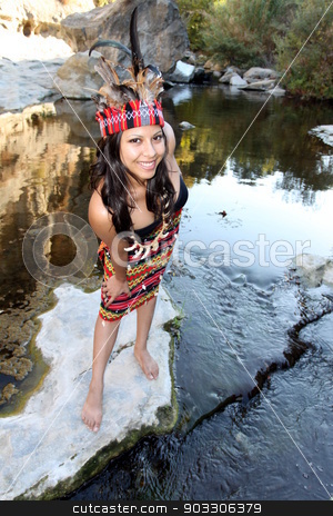 To use this stock image in your creative project, please select the size you need over to the right and click the "Add to Cart" button.
Your downloaded image will come with the Cutcaster watermark removed so don’t worry about the watermark you see on this page. Indian Woman stock photo, Native american woman next to a creek. by Henrik Lehnerer