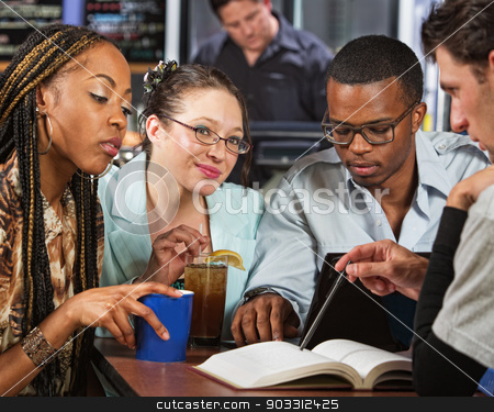 To use this stock image in your creative project, please select the size you need over to the right and click the "Add to Cart" button.
Your downloaded image will come with the Cutcaster watermark removed so don’t worry about the watermark you see on this page. Students Studying stock photo, Cute group of four diverse students at table with book by Scott Griessel