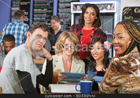 To use this stock image in your creative project, please select the size you need over to the right and click the "Add to Cart" button.
Your downloaded image will come with the Cutcaster watermark removed so don’t worry about the watermark you see on this page. Smiling Diverse Students stock photo, Mixed group of students with tablet computer in cafe by Scott Griessel