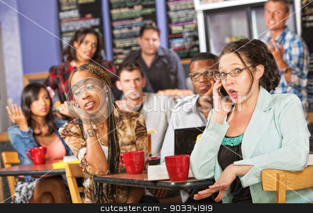 To use this stock image in your creative project, please select the size you need over to the right and click the "Add to Cart" button.
Your downloaded image will come with the Cutcaster watermark removed so don’t worry about the watermark you see on this page. Talkative Woman in Cafe stock photo, Talkative female on cell phone annoying students in cafe by Scott Griessel