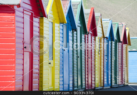 To use this stock image in your creative project, please select the size you need over to the right and click the "Add to Cart" button.
Your downloaded image will come with the Cutcaster watermark removed so don’t worry about the watermark you see on this page. Row of colorful wooden beach huts stock photo, Row of colorful traditional wooden beach huts overlooking the Whitby Sands beach, Whitby, North Yorkshire, close up view receding from the camera by Stephen Gibson