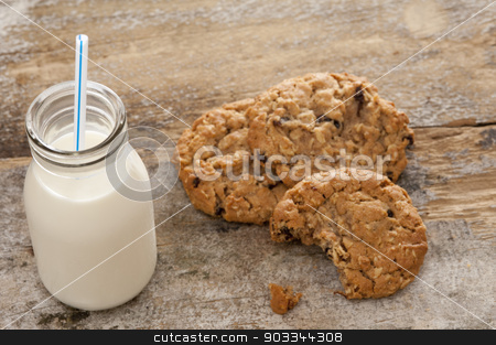 To use this stock image in your creative project, please select the size you need over to the right and click the "Add to Cart" button.
Your downloaded image will come with the Cutcaster watermark removed so don’t worry about the watermark you see on this page. Bottle of milk with half eaten cookies stock photo, Small glass bottle of fresh creamy farm milk with a straw alongside half eaten crunchy cookies on a rustic wooden surface, high angle view by Stephen Gibson