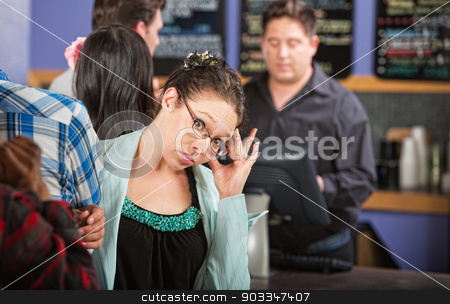 To use this stock image in your creative project, please select the size you need over to the right and click the "Add to Cart" button.
Your downloaded image will come with the Cutcaster watermark removed so don’t worry about the watermark you see on this page. Cafe Customer with Headache stock photo, Annoyed cafe customer waiting in line to order by Scott Griessel