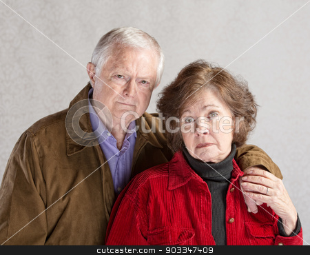 To use this stock image in your creative project, please select the size you need over to the right and click the "Add to Cart" button.
Your downloaded image will come with the Cutcaster watermark removed so don’t worry about the watermark you see on this page. Serious Mature Couple stock photo, Serious European man and woman holding hands by Scott Griessel