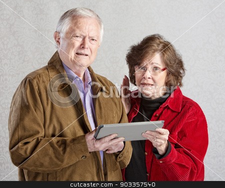 To use this stock image in your creative project, please select the size you need over to the right and click the "Add to Cart" button.
Your downloaded image will come with the Cutcaster watermark removed so don’t worry about the watermark you see on this page. Confused Adults with Tablet stock photo, Two mature adults confused with tablet computer by Scott Griessel