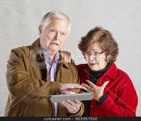 To use this stock image in your creative project, please select the size you need over to the right and click the "Add to Cart" button.
Your downloaded image will come with the Cutcaster watermark removed so don’t worry about the watermark you see on this page. Embarrassed Man with Tablet stock photo, Embarrassed senior man covering his tablet computer by Scott Griessel