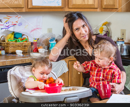 To use this stock image in your creative project, please select the size you need over to the right and click the "Add to Cart" button.
Your downloaded image will come with the Cutcaster watermark removed so don’t worry about the watermark you see on this page. Stressed Out Mother stock photo, Stressed out mother in kitchen with her babies by Scott Griessel
