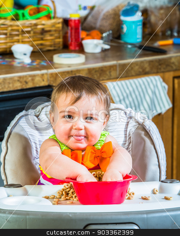 To use this stock image in your creative project, please select the size you need over to the right and click the "Add to Cart" button.
Your downloaded image will come with the Cutcaster watermark removed so don’t worry about the watermark you see on this page. Baby Girl Eats Breakfast stock photo, Baby girl eats breakfast in her highchair by Scott Griessel