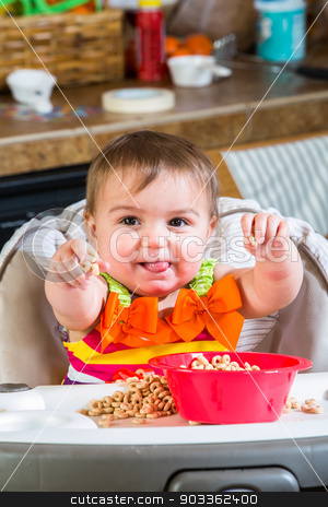 To use this stock image in your creative project, please select the size you need over to the right and click the "Add to Cart" button.
Your downloaded image will come with the Cutcaster watermark removed so don’t worry about the watermark you see on this page. Baby Girl Eats Breakfast stock photo, Baby girl eats breakfast in her highchair by Scott Griessel