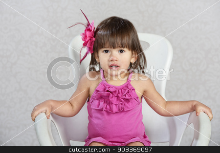 To use this stock image in your creative project, please select the size you need over to the right and click the "Add to Cart" button.
Your downloaded image will come with the Cutcaster watermark removed so don’t worry about the watermark you see on this page. Child with Pink Ribbon in Hair stock photo, Cute toddler in chair with pink ribbon in hair by Scott Griessel