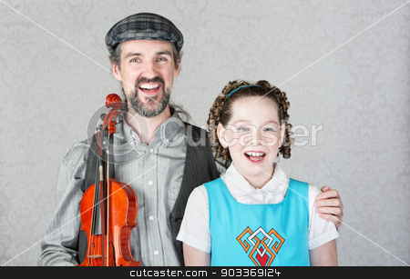 To use this stock image in your creative project, please select the size you need over to the right and click the "Add to Cart" button.
Your downloaded image will come with the Cutcaster watermark removed so don’t worry about the watermark you see on this page. Happy Irish Musician with Child and Fiddle stock photo, Happy irish folk musician and child laughing together by Scott Griessel