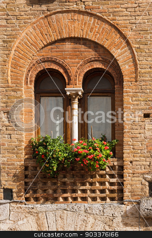 To use this stock image in your creative project, please select the size you need over to the right and click the "Add to Cart" button.
Your downloaded image will come with the Cutcaster watermark removed so don’t worry about the watermark you see on this page. San Gimignano - Siena Tuscany Italy stock photo, Detail of a mullioned window on medieval brick wall in San Gimignano town (UNESCO heritage), Siena, Tuscany, Italy by catalby