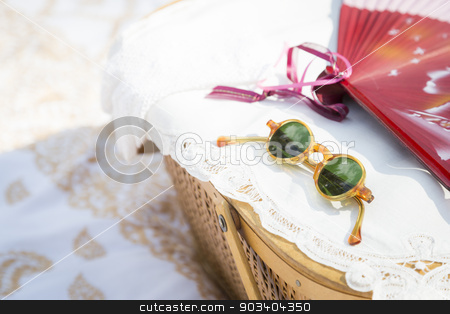 To use this stock image in your creative project, please select the size you need over to the right and click the "Add to Cart" button.
Your downloaded image will come with the Cutcaster watermark removed so don’t worry about the watermark you see on this page. Sunglasses, Chinese Fan and Picnic Basket on Blanket stock photo, Stylish Sunglasses, Chinese Fan and Picnic Basket on Blanket. by Andy Dean