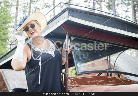 To use this stock image in your creative project, please select the size you need over to the right and click the "Add to Cart" button.
Your downloaded image will come with the Cutcaster watermark removed so don’t worry about the watermark you see on this page. Attractive Woman in Twenties Outfit Near Antique Automobile stock photo, Attractive Young Woman in Twenties Outfit Near Antique Automobile. by Andy Dean