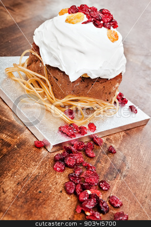 To use this stock image in your creative project, please select the size you need over to the right and click the "Add to Cart" button.
Your downloaded image will come with the Cutcaster watermark removed so don’t worry about the watermark you see on this page. Christmas cake candieds ribbon stock photo, Christmas cake with red candieds ribbon on a wooden table by Dario Rota