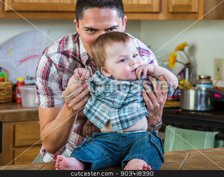 To use this stock image in your creative project, please select the size you need over to the right and click the "Add to Cart" button.
Your downloaded image will come with the Cutcaster watermark removed so don’t worry about the watermark you see on this page. Father Plays With Baby stock photo, A father in kitchen plays with his baby by Scott Griessel