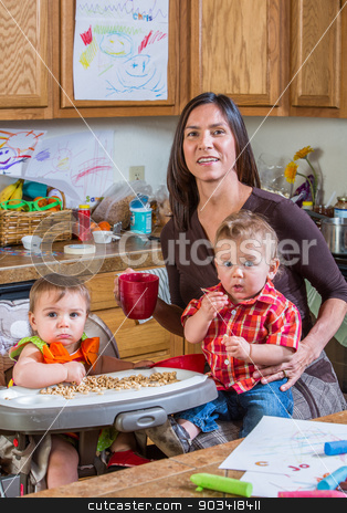 To use this stock image in your creative project, please select the size you need over to the right and click the "Add to Cart" button.
Your downloaded image will come with the Cutcaster watermark removed so don’t worry about the watermark you see on this page. Mother Smiles With Babies stock photo, A mother in the kitchen poses with babies by Scott Griessel
