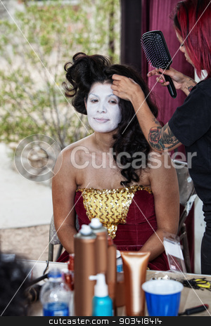 To use this stock image in your creative project, please select the size you need over to the right and click the "Add to Cart" button.
Your downloaded image will come with the Cutcaster watermark removed so don’t worry about the watermark you see on this page. Makeup Artist Working on Cirque Performer stock photo, Makeup artist working on beautiful young circus clown by Scott Griessel