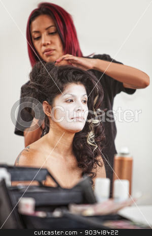 To use this stock image in your creative project, please select the size you need over to the right and click the "Add to Cart" button.
Your downloaded image will come with the Cutcaster watermark removed so don’t worry about the watermark you see on this page. Makeup Artist and Pretty Performer stock photo, Native American makeup artist working beautiful female performer by Scott Griessel