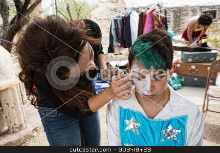 To use this stock image in your creative project, please select the size you need over to the right and click the "Add to Cart" button.
Your downloaded image will come with the Cutcaster watermark removed so don’t worry about the watermark you see on this page. Clown Getting Makeup stock photo, Female makeup artist putting makeup on male clown by Scott Griessel
