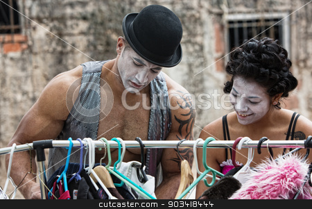 To use this stock image in your creative project, please select the size you need over to the right and click the "Add to Cart" button.
Your downloaded image will come with the Cutcaster watermark removed so don’t worry about the watermark you see on this page. Cirque Clown stock photo, Two cirque clowns choosing costumes at clothing rack by Scott Griessel