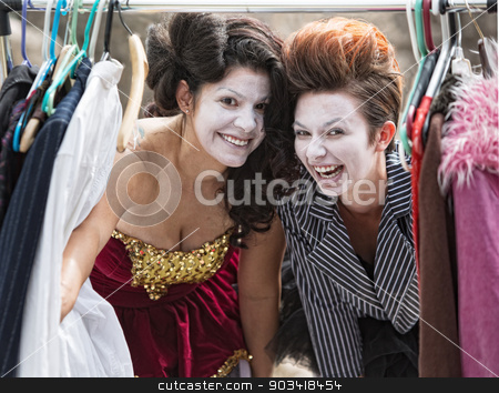To use this stock image in your creative project, please select the size you need over to the right and click the "Add to Cart" button.
Your downloaded image will come with the Cutcaster watermark removed so don’t worry about the watermark you see on this page. Laughing Clowns at Clothes Rack stock photo, Comedia Del Arte actors laughing at clothing rack by Scott Griessel
