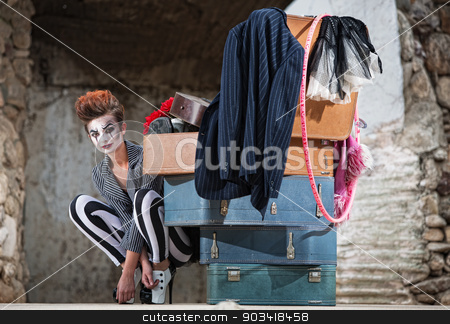 To use this stock image in your creative project, please select the size you need over to the right and click the "Add to Cart" button.
Your downloaded image will come with the Cutcaster watermark removed so don’t worry about the watermark you see on this page. Grinning Clown Near Suitcases stock photo, Grinning female clown squatting near stack of suitcases by Scott Griessel