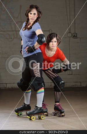 To use this stock image in your creative project, please select the size you need over to the right and click the "Add to Cart" button.
Your downloaded image will come with the Cutcaster watermark removed so don’t worry about the watermark you see on this page. Female Roller Derby Skaters stock photo, Pair of tough Caucasian female roller derby skaters by Scott Griessel