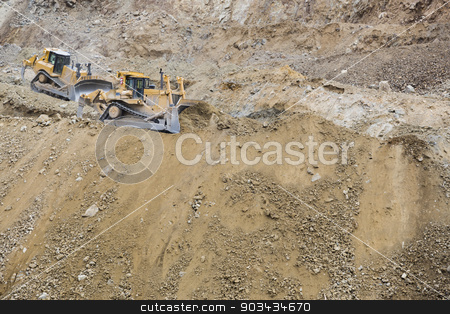 To use this stock image in your creative project, please select the size you need over to the right and click the "Add to Cart" button.
Your downloaded image will come with the Cutcaster watermark removed so don’t worry about the watermark you see on this page. Excavator Tractors Moving Dirt stock photo, Two Excavator Tractors Moving Dirt. by Andy Dean