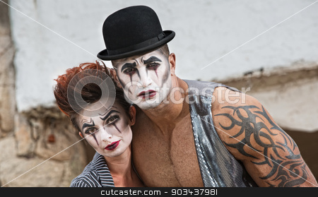 To use this stock image in your creative project, please select the size you need over to the right and click the "Add to Cart" button.
Your downloaded image will come with the Cutcaster watermark removed so don’t worry about the watermark you see on this page. Two Bizarre Comedy Performers stock photo, Strange pair of male and female cirque performers by Scott Griessel