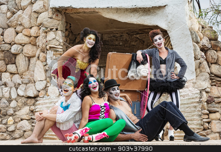 To use this stock image in your creative project, please select the size you need over to the right and click the "Add to Cart" button.
Your downloaded image will come with the Cutcaster watermark removed so don’t worry about the watermark you see on this page. Laughing Cirque Ensemble stock photo, Lauging ensemble of bizarre circus clowns on stage by Scott Griessel