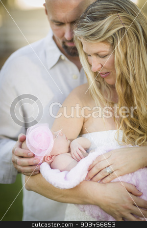 To use this stock image in your creative project, please select the size you need over to the right and click the "Add to Cart" button.
Your downloaded image will come with the Cutcaster watermark removed so don’t worry about the watermark you see on this page. Beautiful Young Couple Holding Their Newborn Baby Girl stock photo, Beautiful Young Couple Holding Their Newborn Baby Girl Outside. by Andy Dean