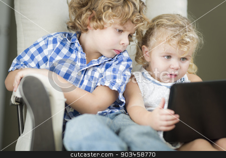 To use this stock image in your creative project, please select the size you need over to the right and click the "Add to Cart" button.
Your downloaded image will come with the Cutcaster watermark removed so don’t worry about the watermark you see on this page. Young Brother and Sister Using Their Computer Laptop Together stock photo, Adorable Young Brother and Sister Using Their Computer Laptop Together. by Andy Dean