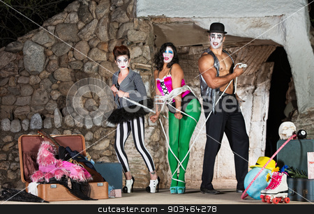 To use this stock image in your creative project, please select the size you need over to the right and click the "Add to Cart" button.
Your downloaded image will come with the Cutcaster watermark removed so don’t worry about the watermark you see on this page. Clowns Tying Up Woman stock photo, Funny cirque clowns tying up woman with rope by Scott Griessel
