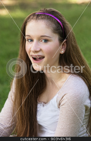 To use this stock image in your creative project, please select the size you need over to the right and click the "Add to Cart" button.
Your downloaded image will come with the Cutcaster watermark removed so don’t worry about the watermark you see on this page. Teen with Braces Laughing stock photo, Single laughing teenage female with braces on teeth by Scott Griessel