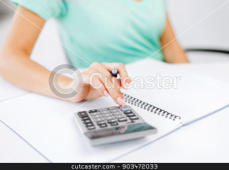 To use this stock image in your creative project, please select the size you need over to the right and click the "Add to Cart" button.
Your downloaded image will come with the Cutcaster watermark removed so don’t worry about the watermark you see on this page. businesswoman working with calculator in office stock photo, business concept - businesswoman working with calculator in office by Syda Productions