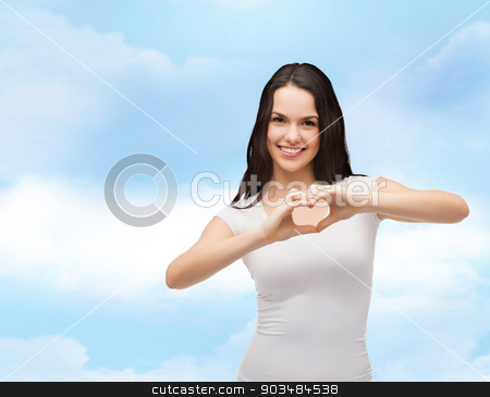 To use this stock image in your creative project, please select the size you need over to the right and click the "Add to Cart" button.
Your downloaded image will come with the Cutcaster watermark removed so don’t worry about the watermark you see on this page. smiling girl showing heart with hands stock photo, love, t-shirt design and happy people concept - smiling girl in white blank t-shirts showing heart with hands by Syda Productions
