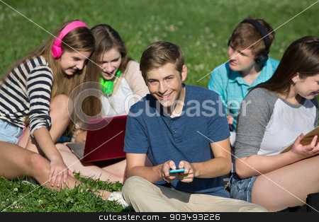 To use this stock image in your creative project, please select the size you need over to the right and click the "Add to Cart" button.
Your downloaded image will come with the Cutcaster watermark removed so don’t worry about the watermark you see on this page. Male Teen Texting stock photo, Group of cheerful students texting and studying by Scott Griessel
