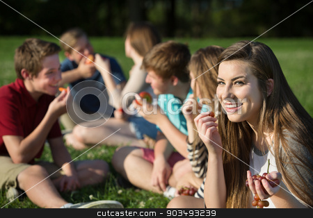 To use this stock image in your creative project, please select the size you need over to the right and click the "Add to Cart" button.
Your downloaded image will come with the Cutcaster watermark removed so don’t worry about the watermark you see on this page. Teen Girl Eating Grapes stock photo, Cute female Caucasian teenager eating grapes with friends by Scott Griessel