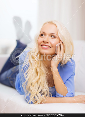 To use this stock image in your creative project, please select the size you need over to the right and click the "Add to Cart" button.
Your downloaded image will come with the Cutcaster watermark removed so don’t worry about the watermark you see on this page. smiling woman with smartphone at home stock photo, home, technology and communication concept - smiling woman with smartphone lying on couch at home by Syda Productions