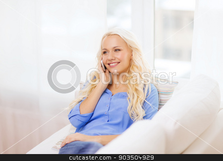 To use this stock image in your creative project, please select the size you need over to the right and click the "Add to Cart" button.
Your downloaded image will come with the Cutcaster watermark removed so don’t worry about the watermark you see on this page. smiling woman with smartphone at home stock photo, home, technology and communication concept - smiling woman with smartphone lying on couch at home by Syda Productions