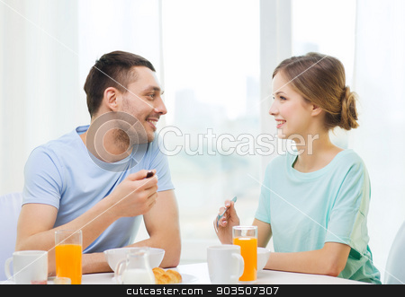 To use this stock image in your creative project, please select the size you need over to the right and click the "Add to Cart" button.
Your downloaded image will come with the Cutcaster watermark removed so don’t worry about the watermark you see on this page. smiling couple having breakfast at home stock photo, food, home, couple and happiness concept - smiling couple having breakfast at home by Syda Productions