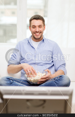 To use this stock image in your creative project, please select the size you need over to the right and click the "Add to Cart" button.
Your downloaded image will come with the Cutcaster watermark removed so don’t worry about the watermark you see on this page. smiling man watching sports at home stock photo, sports, food, happiness and people concept - smiling man with popcorn watching sports on tv and supporting team at home by Syda Productions