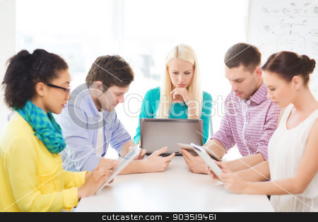 To use this stock image in your creative project, please select the size you need over to the right and click the "Add to Cart" button.
Your downloaded image will come with the Cutcaster watermark removed so don’t worry about the watermark you see on this page. serious team with table pc and laptop in office stock photo, business, office, technology and startup concept - serious creative team with table pc and laptop computers working in office by Syda Productions