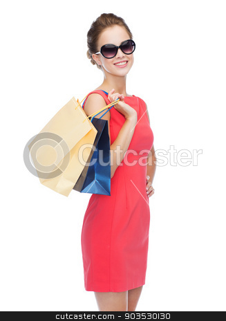 To use this stock image in your creative project, please select the size you need over to the right and click the "Add to Cart" button.
Your downloaded image will come with the Cutcaster watermark removed so don’t worry about the watermark you see on this page. smiling elegant woman in dress with shopping bags stock photo, shopping, sale, christmas and holiday concept - smiling elegant woman in red dress and sunglasses with shopping bags by Syda Productions
