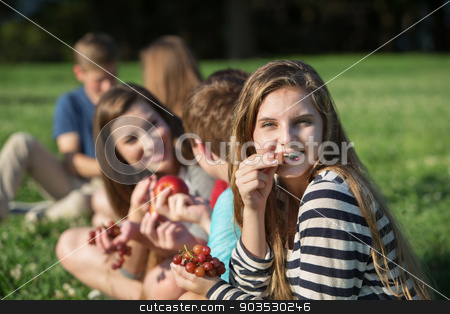 To use this stock image in your creative project, please select the size you need over to the right and click the "Add to Cart" button.
Your downloaded image will come with the Cutcaster watermark removed so don’t worry about the watermark you see on this page. Girl with Braces Eating Grapes stock photo, Cute young female eating grapes with group outdoors by Scott Griessel