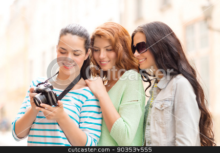 To use this stock image in your creative project, please select the size you need over to the right and click the "Add to Cart" button.
Your downloaded image will come with the Cutcaster watermark removed so don’t worry about the watermark you see on this page. smiling teenage girls with camera stock photo, tourism, travel, leisure, holidays and friendship concept - smiling teenage girls with camera outdoors by Syda Productions