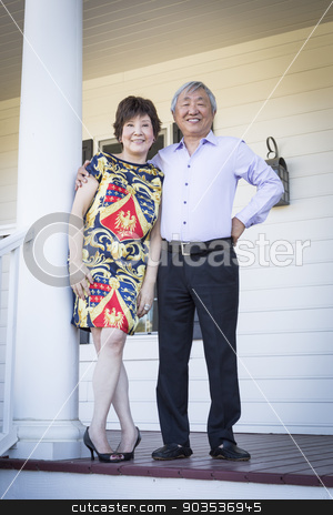 To use this stock image in your creative project, please select the size you need over to the right and click the "Add to Cart" button.
Your downloaded image will come with the Cutcaster watermark removed so don’t worry about the watermark you see on this page. Attractive Chinese Couple Enjoying Their House stock photo, Attractive Happy Chinese Couple Enjoying Their House Outside. by Andy Dean