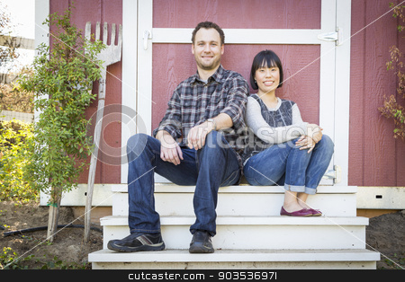To use this stock image in your creative project, please select the size you need over to the right and click the "Add to Cart" button.
Your downloaded image will come with the Cutcaster watermark removed so don’t worry about the watermark you see on this page. Mixed Race Couple Relaxing on the Steps stock photo, Happy Mixed Race Couple Relaxing on the Steps of Their Barn. by Andy Dean