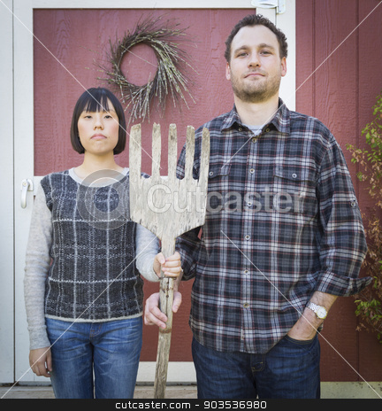To use this stock image in your creative project, please select the size you need over to the right and click the "Add to Cart" button.
Your downloaded image will come with the Cutcaster watermark removed so don’t worry about the watermark you see on this page. Fun Mixed Race Couple Portrait Simulating the American Gothic Pa stock photo, Fun Mixed Race Couple Portrait Simulating the American Gothic Painting by Grant Wood. by Andy Dean